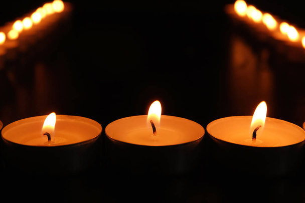 Burning candles on dark background - Fotoğraf, Görsel