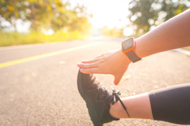 Women exercise in the morning with SmartWatch. - 写真・画像