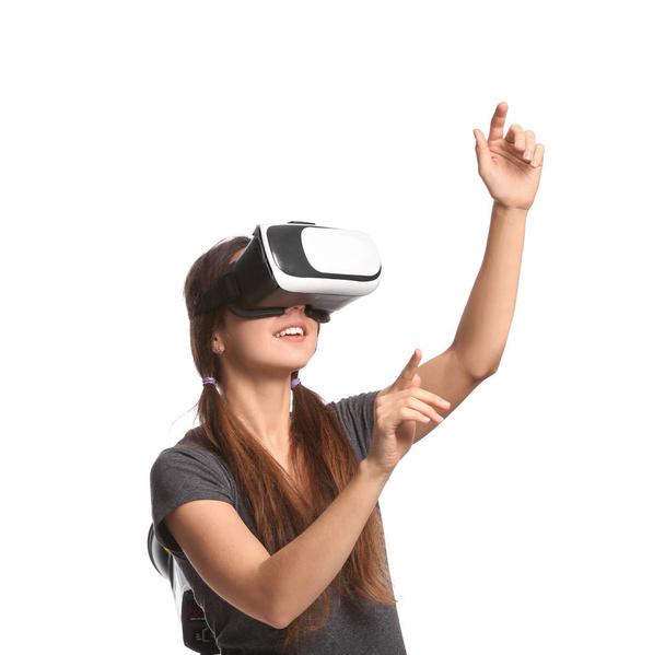 Young woman with virtual reality glasses on white background - Photo, Image