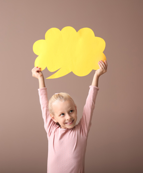 Little girl with blank speech bubble on color background - Fotoğraf, Görsel