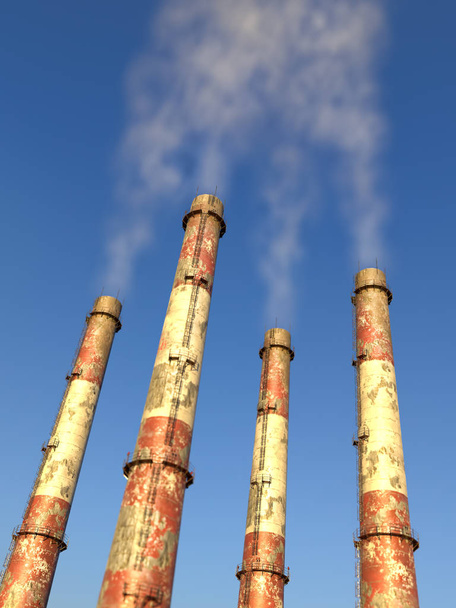 Quattro camini industriali che generano inquinamento nell'aria
 - Foto, immagini