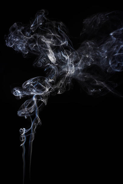 Freeze motion of smoke on black background.  Abstract vape clouds. - Фото, зображення