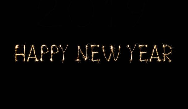Happy New Year text handmade written sparkles fireworks. - Zdjęcie, obraz