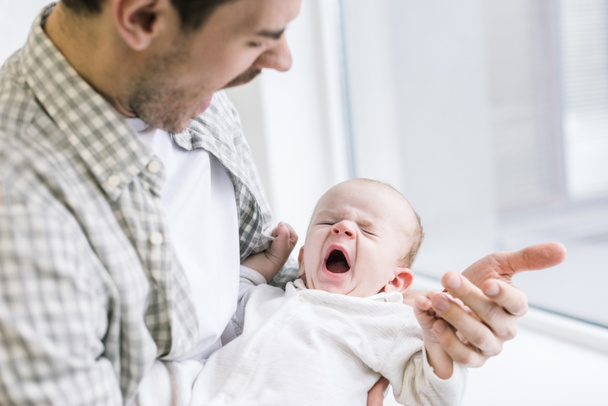 young father copying son while he yawning at home - Fotoğraf, Görsel