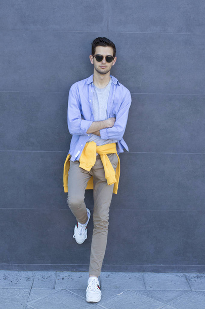 fashionable young man on the street wall - Photo, Image