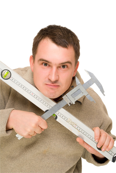 Seriöser Mann hält Werkzeug und Trammel in der Hand - Foto, Bild