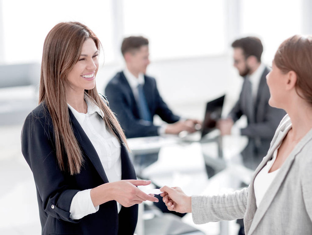 successful business woman gives her business card - Photo, image