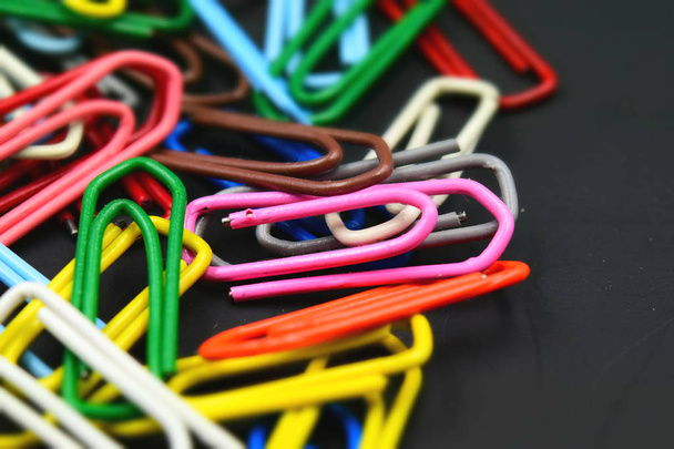 Colorful paper clips. Tilt-shift effect applied. Copy space. - Photo, Image