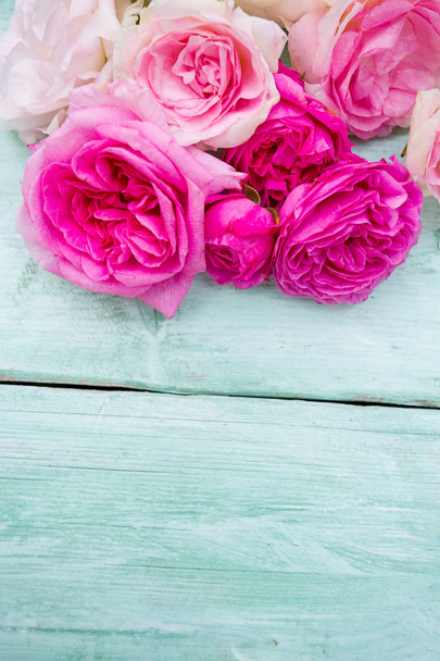 beautiful garden roses on turquoise wooden surface - Photo, image