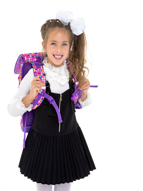 Beautiful little girl in a school uniform. - Foto, Bild