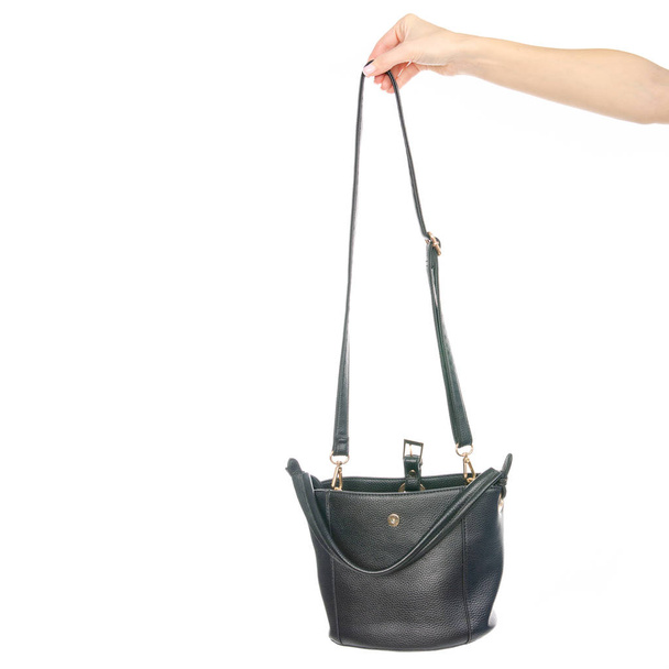 Woman's female black leather bag in hand - Fotoğraf, Görsel
