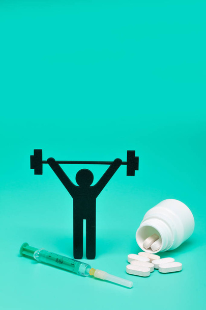 weightlifting pictogram with pills and yellow background - Photo, Image