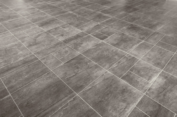 Серые мраморные прямоугольные плитки текстуры поверхности напольных покрытий. Крупный план декоративного фона интерьера
 - Фото, изображение