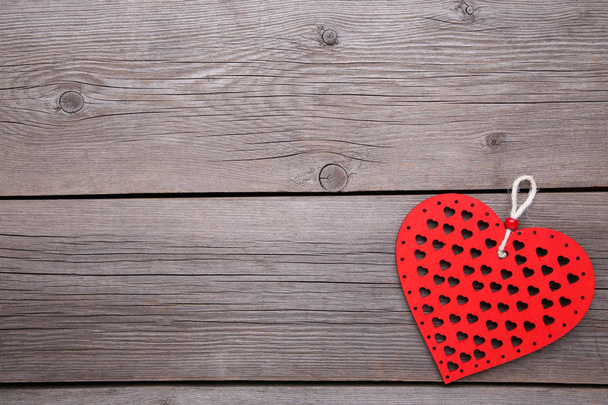 Red wooden hearts on grey wooden background - Fotografie, Obrázek