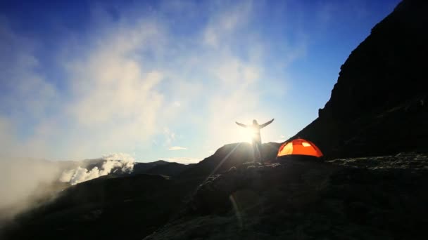 Female Celebrating Dawn Outside Expedition Tent - Footage, Video
