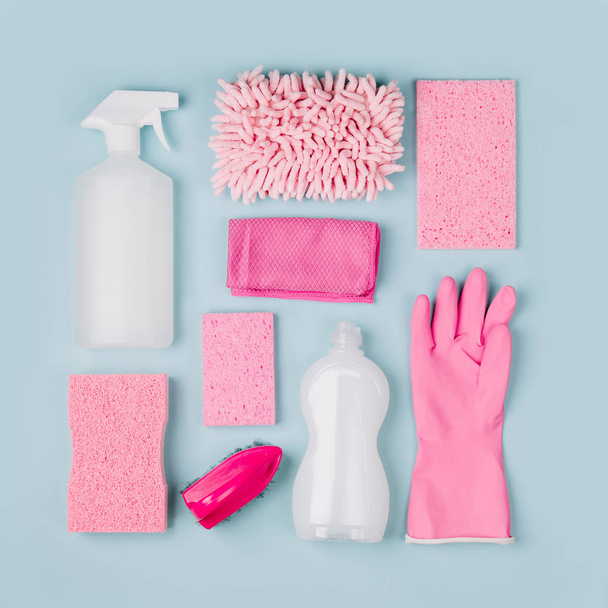 Detergents and cleaning accessories  in pink color.  Cleaning service concept. Flat lay, Top view. - Foto, immagini