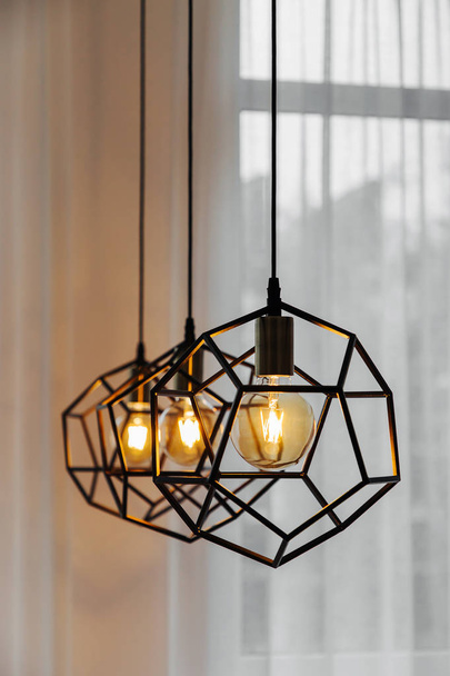 Lamp in modern style with Edison's light bulb. Warm tone light bulb lamp. Stylish interior. - Foto, Imagen
