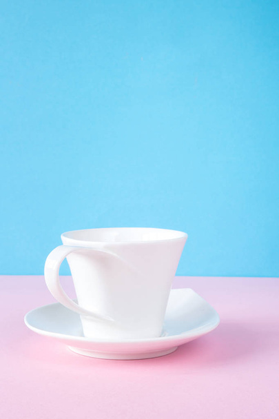 Close up of white cup on colorful background - Fotó, kép