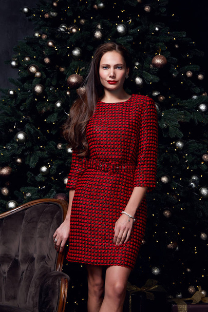 Beautiful sexy pretty lady celebration holiday party style wear fashion dress merry Christmas Eve and Happy New Year gift box Christmas tree woman accessory clothes model present glitter. - Фото, зображення