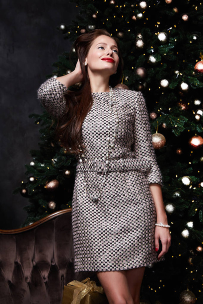 Beautiful sexy pretty lady celebration holiday party style wear fashion dress merry Christmas Eve and Happy New Year gift box Christmas tree woman accessory clothes model present glitter. - Φωτογραφία, εικόνα