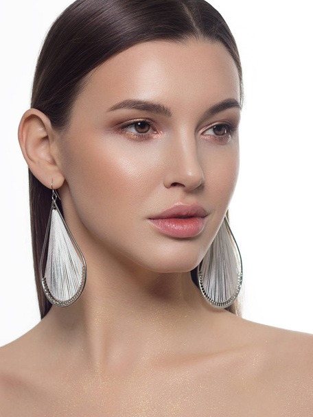 Close-up portrait of a beauty woman with full lips, straight hair and perfectly clean skin. Daytime makeup, styling and soft care. Skin care in the spa salon or cosmetology, smooth eyebrows - Zdjęcie, obraz