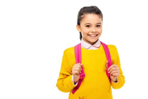 adorable child with backpack looking at camera and smiling isolated on white - Photo, Image