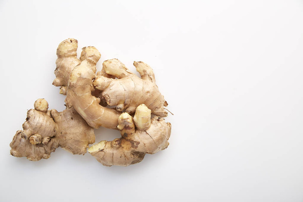 Healthy Fresh Ginger root with medicinal properties and is the elixir on white background - Photo, Image