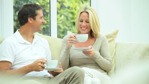 Attractive Couple Relaxing with Cup of Coffee - Imágenes, Vídeo