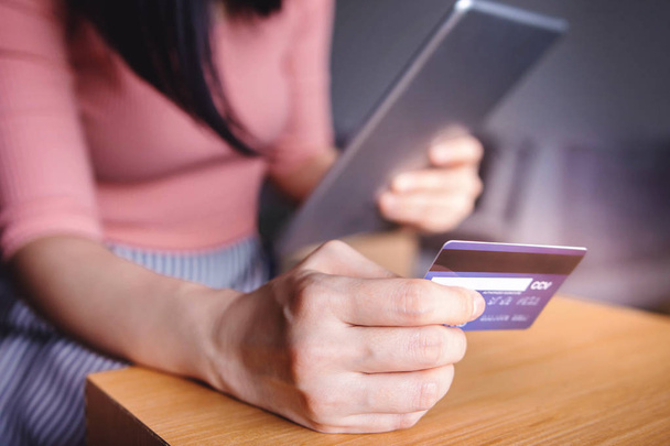 Woman Customer using Credit Card and Tablet to Shopping Online. Close-up shot and Selective focus - Photo, Image