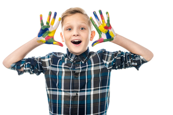 boy with opened mouth showing hands painted in colorful paints and looking at camera isolated on white - Fotoğraf, Görsel