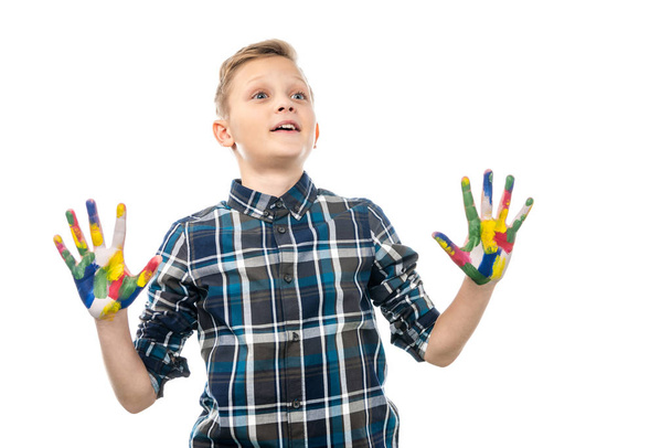 surprised boy with hands painted in colorful paints isolated on white - Photo, Image