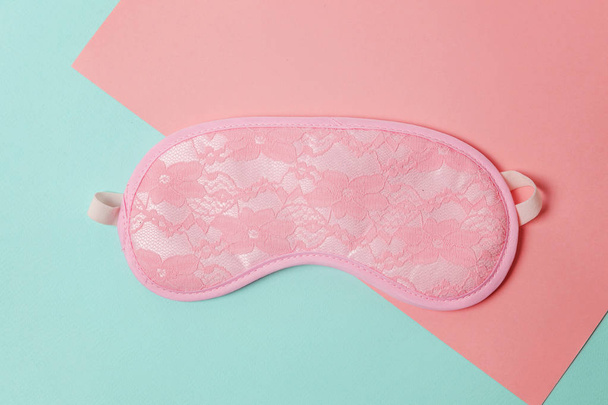 Sleeping eye mask, alarm clock isolated on blue pink pastel colorful trendy geometric background. Do not disturb me, let me sleep. Rest, good night, siesta, insomnia, relaxation, tired, travel concept - Fotó, kép