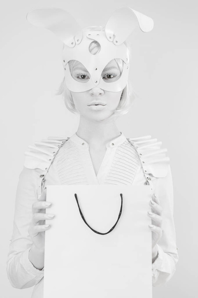 Studio fashion portrait of beautiful white lady in mask rabbit with glass of milk - Fotoğraf, Görsel