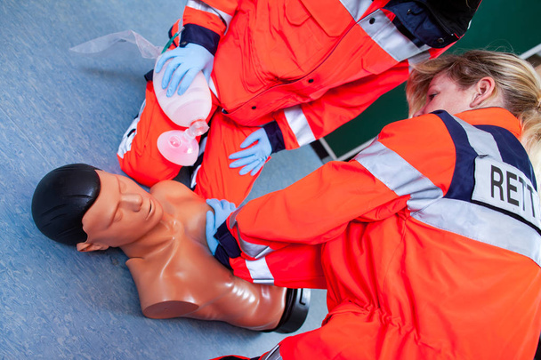 German paramedic trains emergency basics on a puppet - Photo, Image