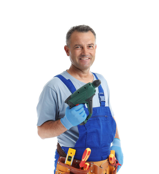 Electrician with drill wearing uniform on white background - Fotoğraf, Görsel