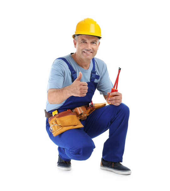 Electrician with tools wearing uniform on white background - Fotoğraf, Görsel