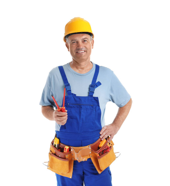 Electrician with tools wearing uniform on white background - Zdjęcie, obraz