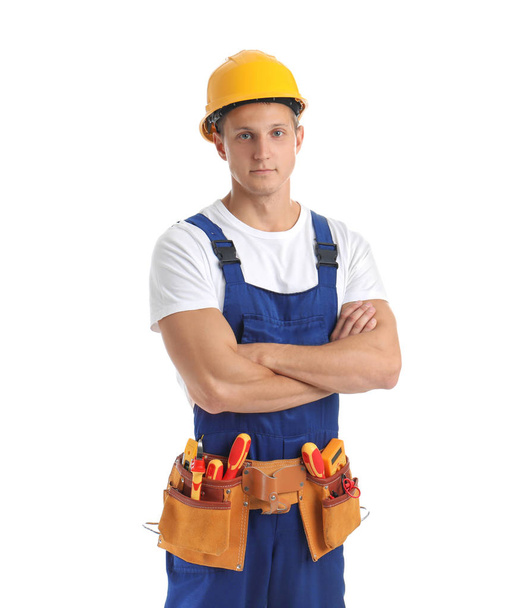Electrician with tools wearing uniform on white background - Foto, Imagen