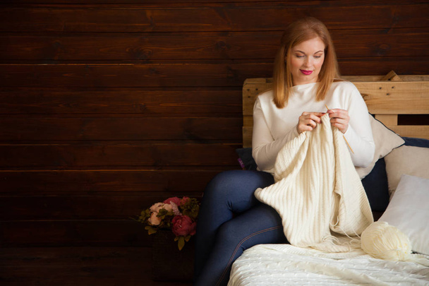 Close-up of woman hands knitting colorful wool yarn. Close-up horizontal photo. Freelance creative working and living concept. - Valokuva, kuva