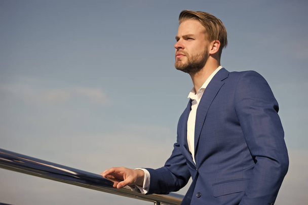 Manager on blue sky. Bearded man in business suit outdoor. Businessman on sunny day. Business fashion, style and dress code. Career, success and future concept, copy space - Photo, image