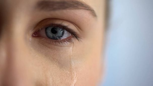 Sad woman crying, suffering pain eyes full of tears, domestic violence victim - Фото, изображение