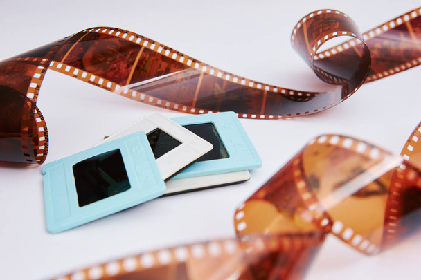 film and slides on a white background, in a beautiful composition - Photo, Image