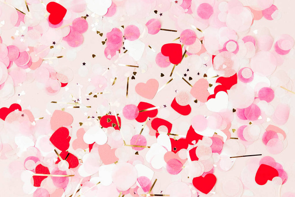 Background of pale pink paper confetti shape of heart, holiday concept - Valokuva, kuva