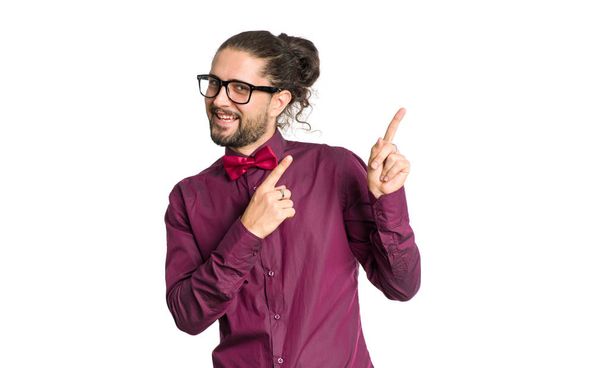 Portrait of cheerful smiling man in shirt and bow tie showing up isolated on white background. - Photo, image