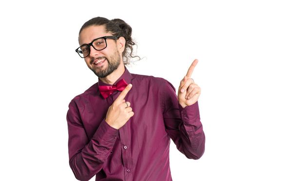 Portrait of cheerful smiling man in shirt and bow tie showing up isolated on white background. - Foto, immagini