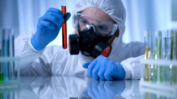 Worker of disease control center going to study toxic blood for cure invention - Фото, изображение