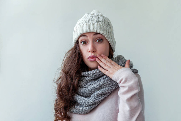 Beautiful woman winter portrait, true emotions. Laughing girl with long hair wearing warm clothes hat scarf isolated on white background. Young hipster girl looking happy and excited, having fun - Fotoğraf, Görsel
