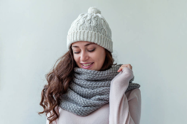 Beautiful woman winter portrait, true emotions. Laughing girl with long hair wearing warm clothes hat scarf isolated on white background. Young hipster girl looking happy and excited, having fun - Foto, Imagem