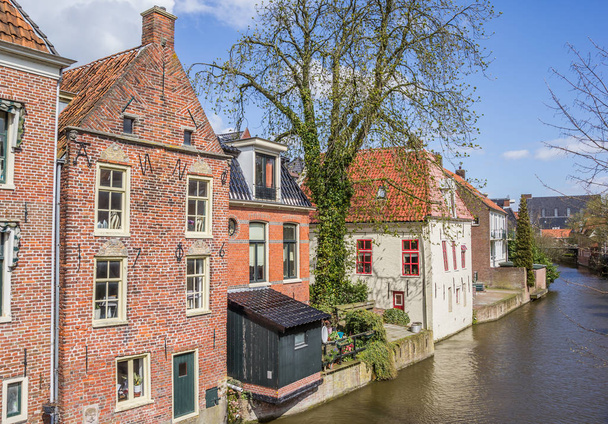 Old houses along a canal in Appingedam, Netherlands - Φωτογραφία, εικόνα