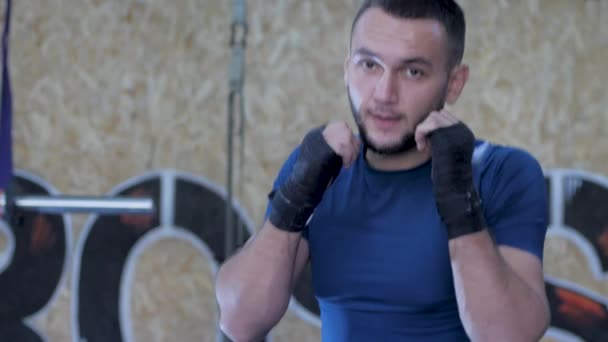 Yong male boxer training indoors - Video, Çekim